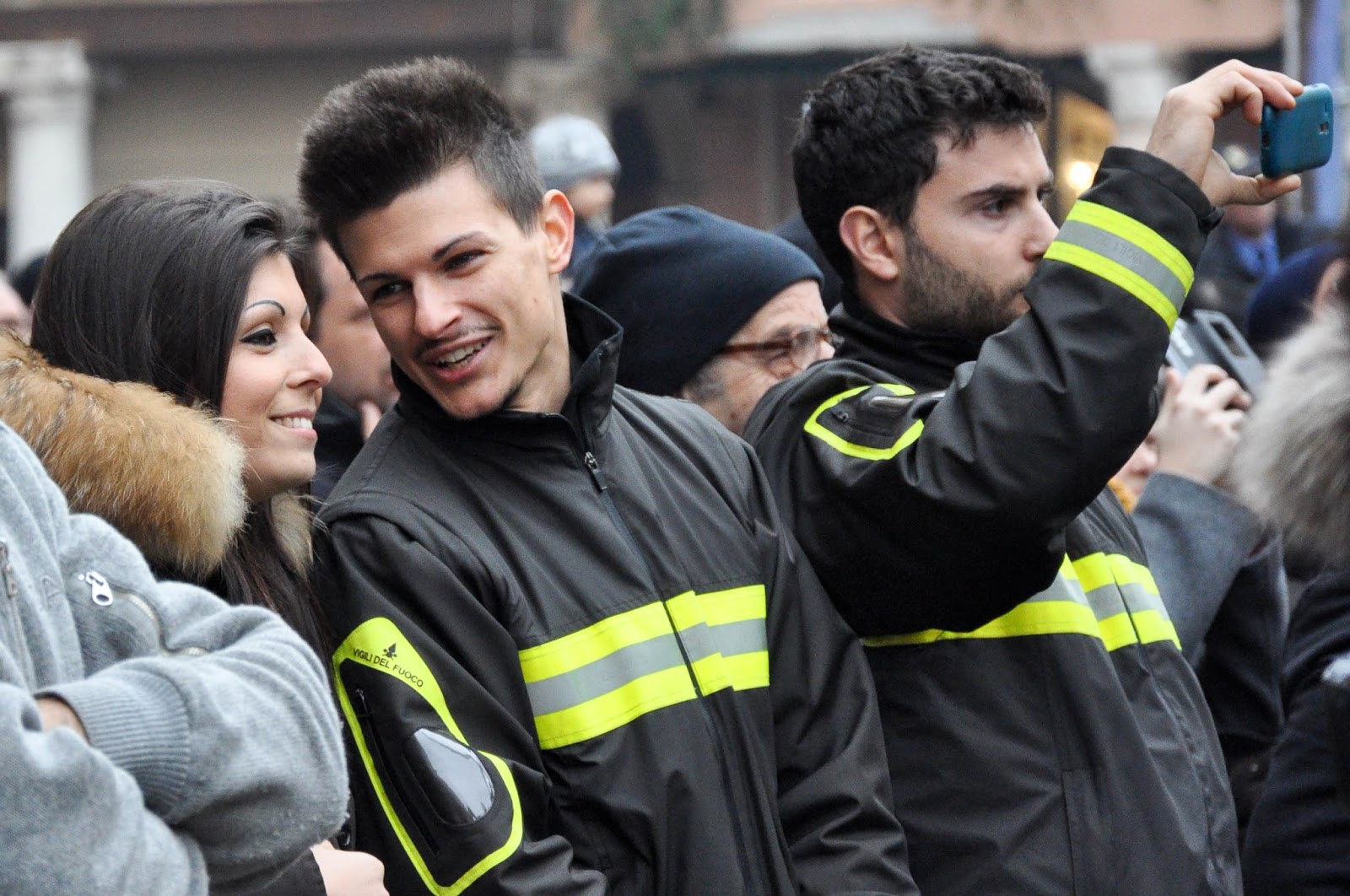 Firefighters watching their colleagues' demonstration on Piazza dei Signori, Saint Barbara celebration, Vicenza, Veneto, Italy