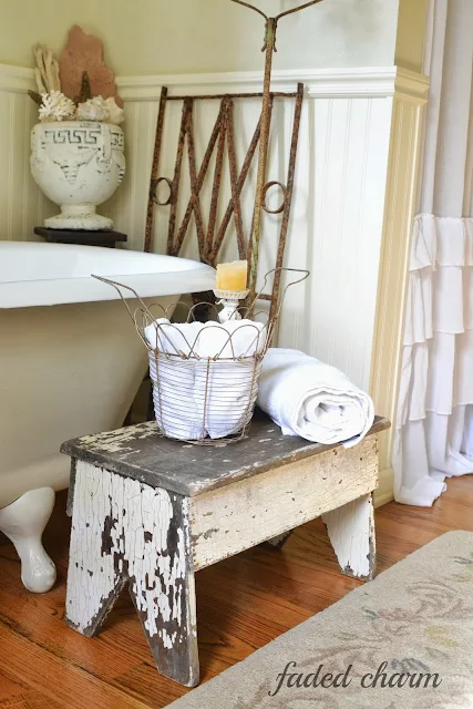 Chippy bench in the bathroom / A beautifully reclaimed bathroom tour by Faded Charm, featured on http://www.ilovethatjunk.com