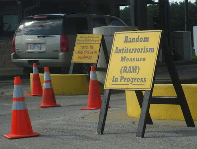 Car at a check point with sign, Random Anti-Terrorism Measure in Progress