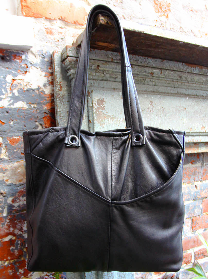 Uptown Redesigns Newly Upcycled Leather Bags in a Beautiful New Orleans Courtyard