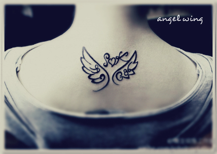 comic style angel wing tattoo designs on the back with heart in the middle