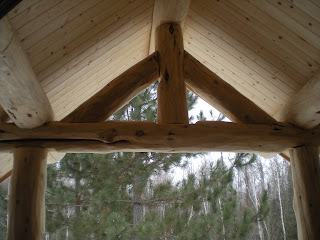 log truss from inside the covered entry, https://huismanconcepts.com/