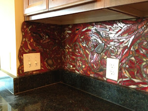 This mosaic installation is a kitchen backsplash in a private residence in Pa