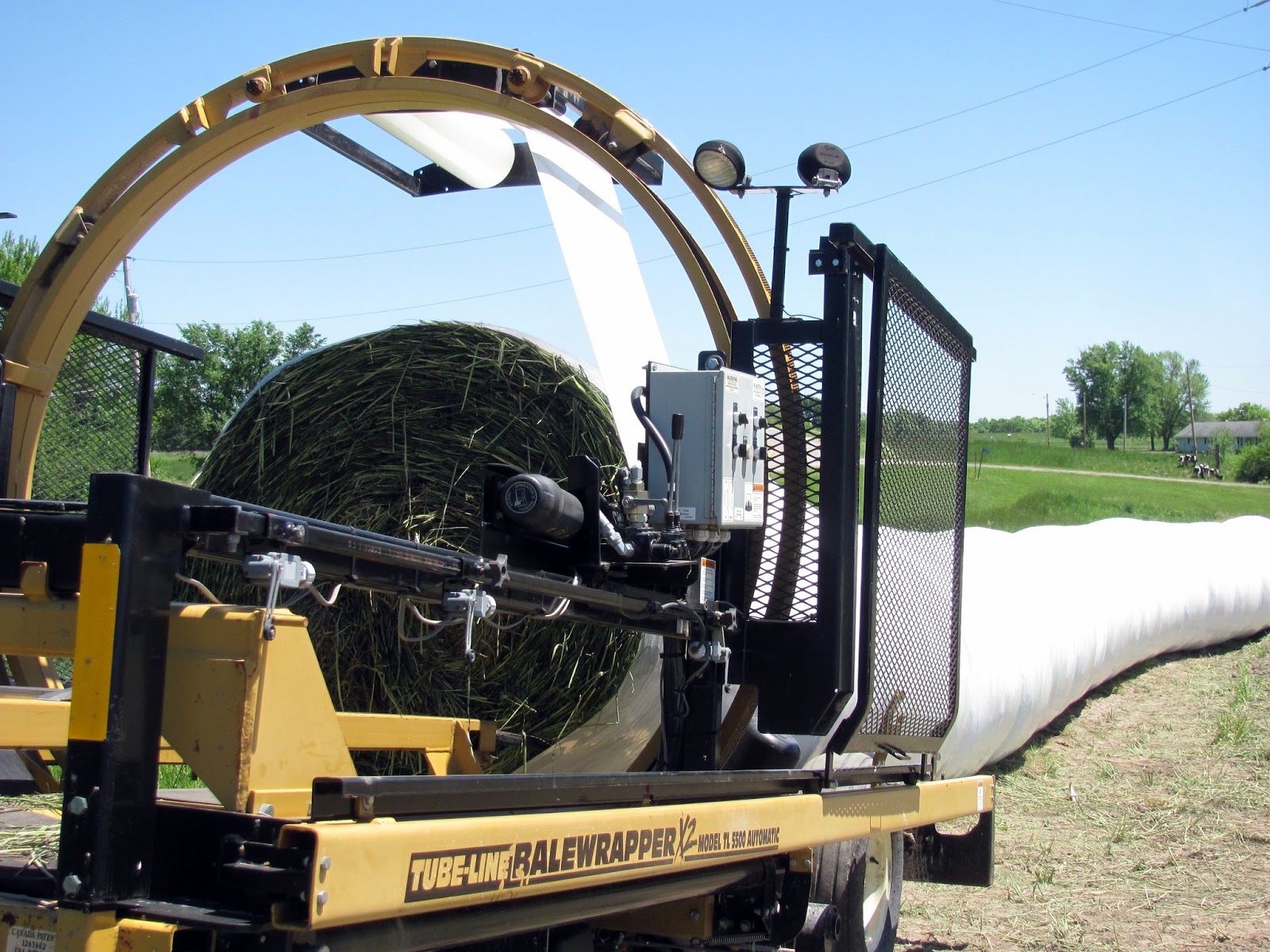 curving back tube line bale wrapper