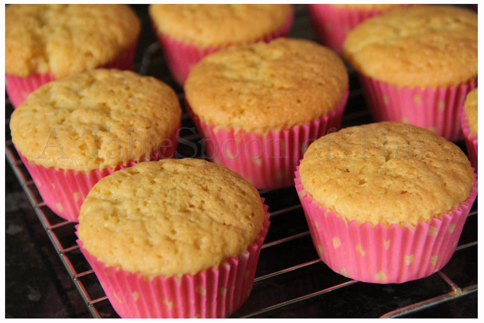 A TableSpoon Of This Vanilla cupcakes with strawberry