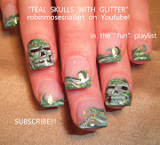 . and a memorial rainbow and dog paw print nail art design for monday :) (teal skulls with glitter)