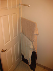 Towel organizer behind the door :: OrganizingMadeFun.com