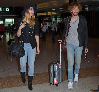 Very easy, but it's casual fashion trend as the Supermodel, Bridget Malcolm, 23, appeared wearing a navy jeans, worn with a huge hat, and stuffed a dark blazer at the airport in Sydney, Australia on Sunday, December 20, 2015.