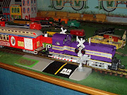 This comicallooking train was one of the largest at the model railroad . (purple train)