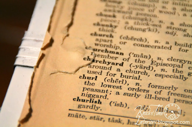 Repurposed Dictionary Pages via Knick of Time Repurposed Trunk into Wall Cabinet with Dictionary Pages and Framed Mirror by Knick of Time