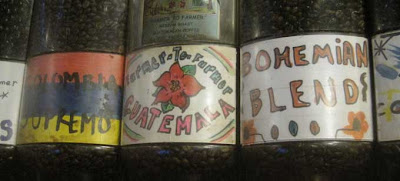 Farmer to Farmer Guatemala coffee sign with hand drawn flower