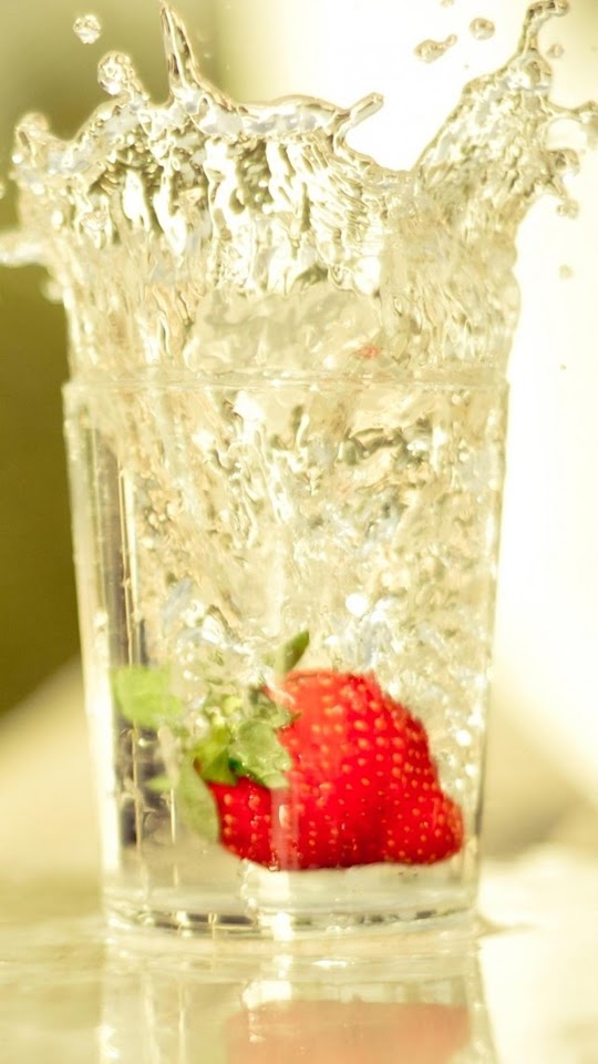 Strawberry Falling In Glass Of Water Android Wallpaper