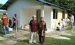 Volunteers painting the house