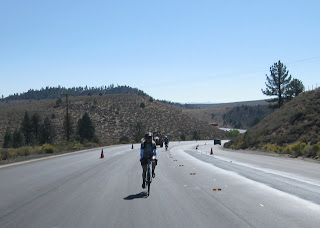 Bicycling up the center of U.S. Route 395 toward Tom's Place Resort.