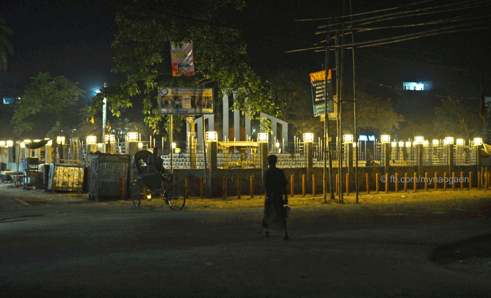 Night view of Naogaon Kendriyo Shahid Minar at Muktir Mor.