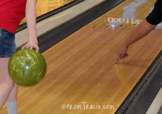 Thomas pointing to the bowling lane