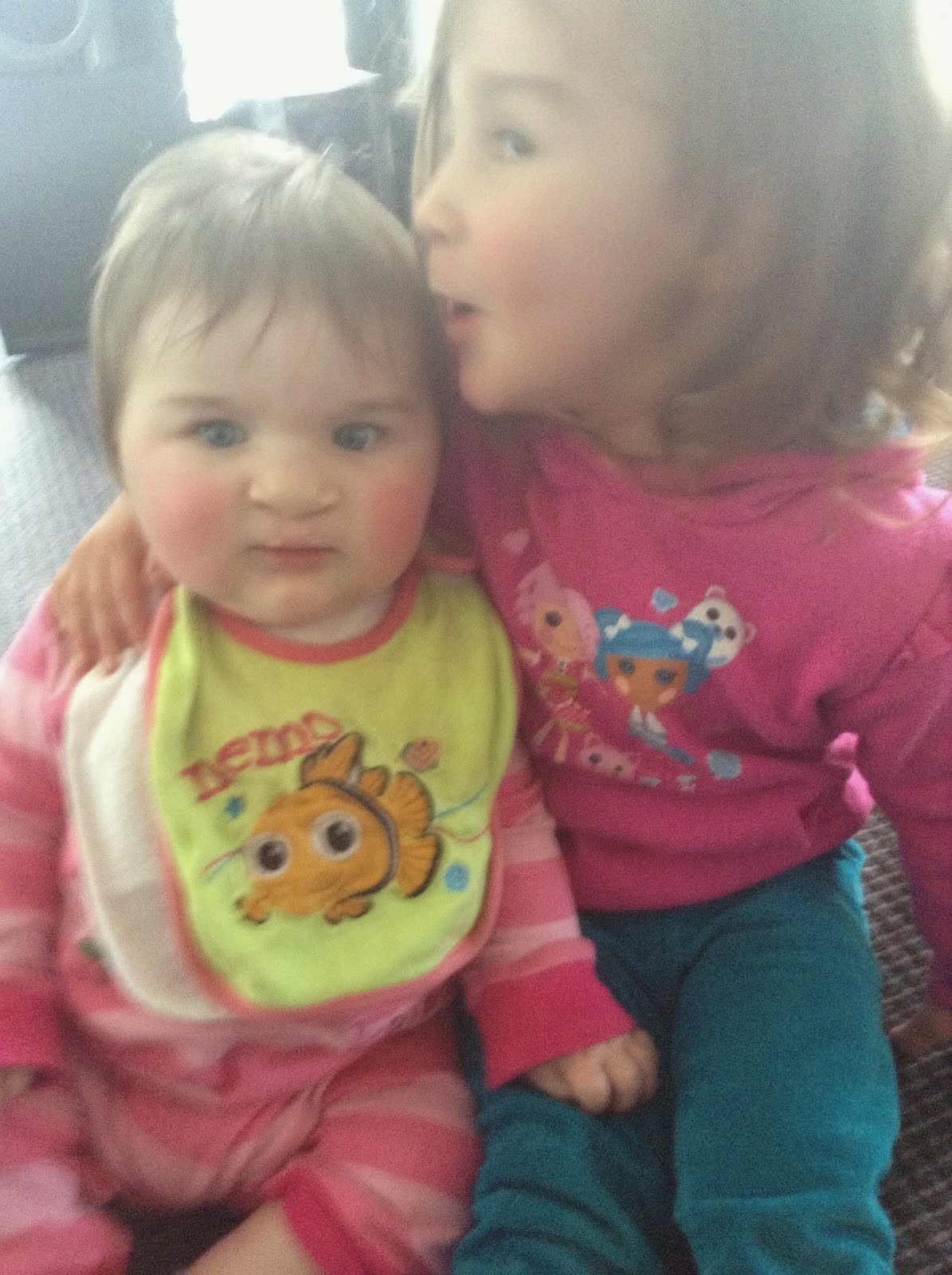 Ellie, 9 months, with big sister Sophie