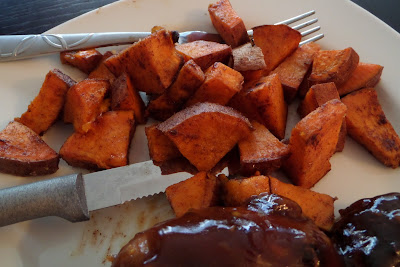 Bite-sized chunks of sweet potato tossed in coconut oil, cumin, and cinnamon.  Then baked until crispy and soft.