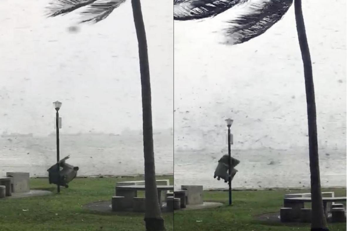 Screengrabs from a video showing a large dumpster being flung by strong winds at East Coast Park.