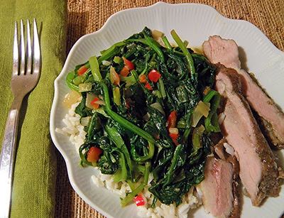 Plate of Greens over Rice with Slices of Turkey
