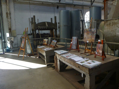 Exhibition of oil paintings in blacksmith's workshop, Eveleigh Railway Workshops painted during ATP Open Day by industrial heritage artist Jane Bennett