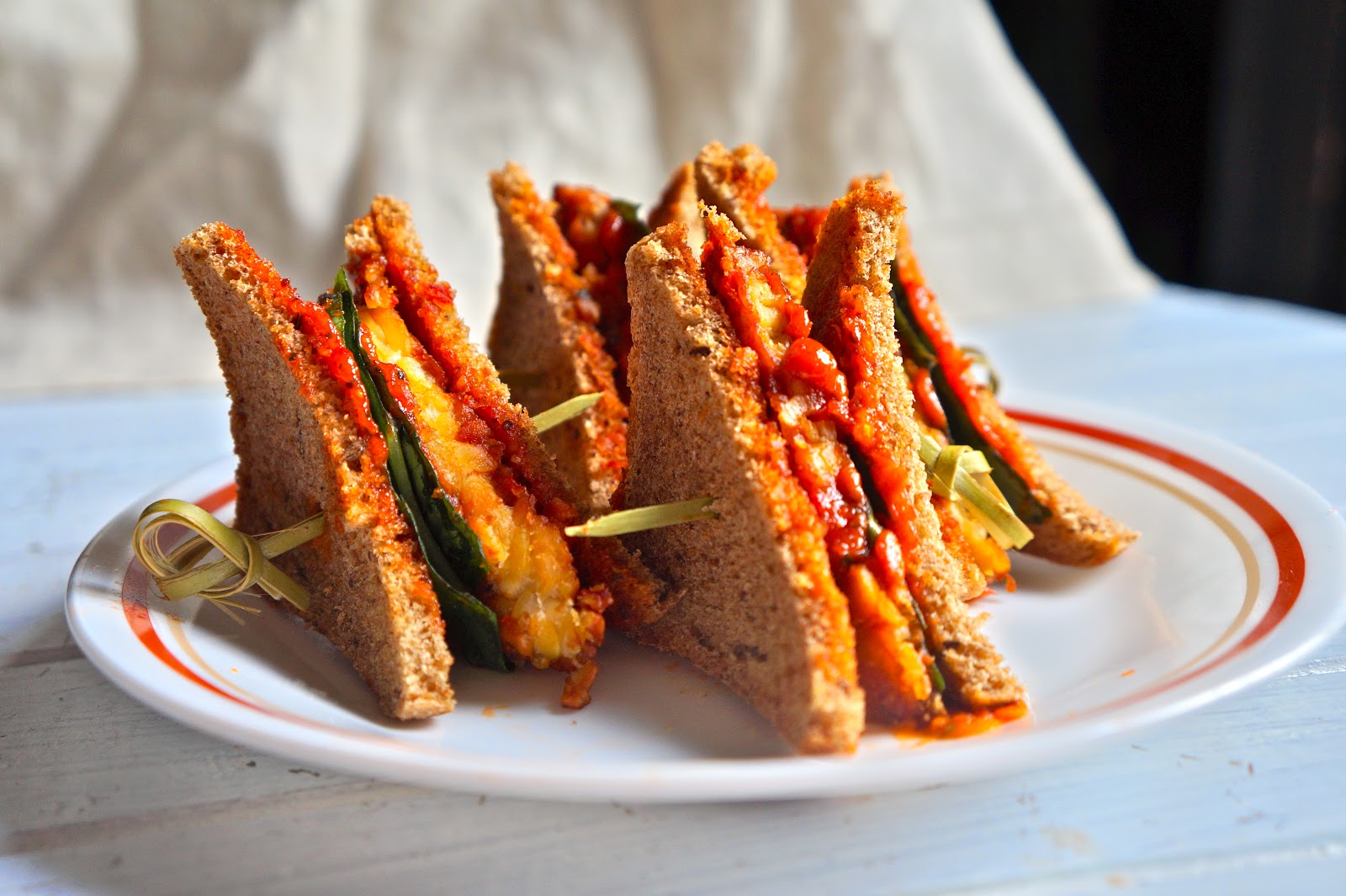 tempeh sandwich with sun dried tomato pestomayo sauce