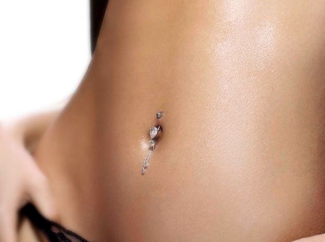 surface piercing with the rejection and migration risks. Navel Piercing
