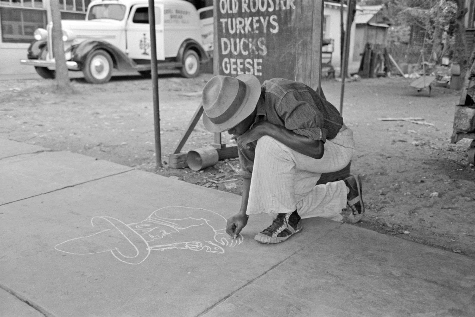 Russell+Lee+-+Negro+boy+drawing+on+the+sidewalk,+New+Iberia,+Louisiana,+1938.jpg