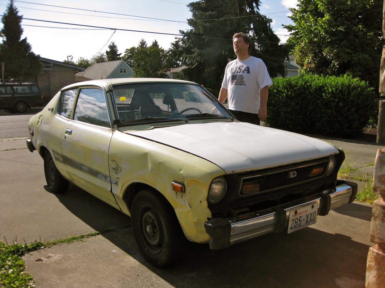 OLD PARKED CARS. 1977 Datsun Honeybee B210.