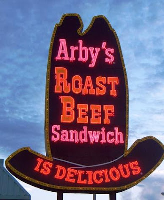 a finger at arby's sandwich