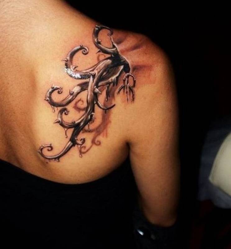 3D root tattoo on back 