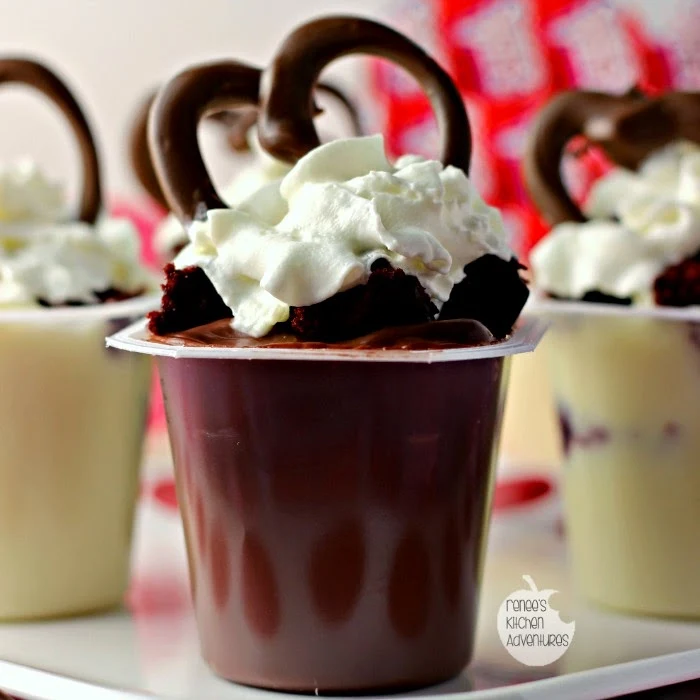 Easy Red Velvet Pudding Cups | pudding cups get decked out with red velvet cake pieces, whipped topping, and a chocolate heart just in time for Valentine's Day! 