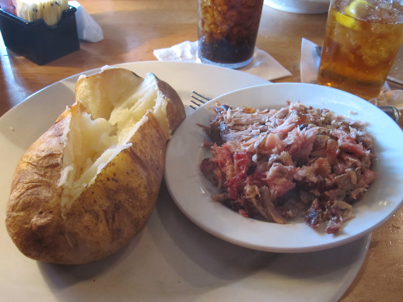Man Up Tales of Texas BBQ™ Pulledpork potato at Jim 'N Nick's BarB