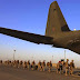 U.S. Marines prepare to board a plane at the end of operations in Helmand  