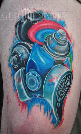 Above This graffiti tattoo depicts both a spraycan and a gas mask used by