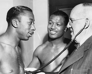 Sugar Ray Robinson and George 'Sugar' Costner with doctor