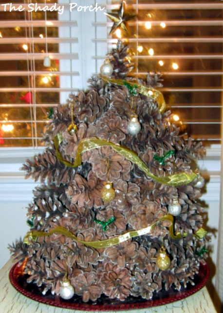 Rustic Pine Cone Christmas Tree by The Shady Porch Rustic Pine Cone Christmas Tree #Christmas #decorations #pinecones #rustic