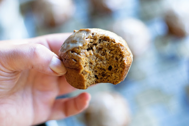 A picture of the pumpkin spiced latte muffin with a bite taken out of it. 