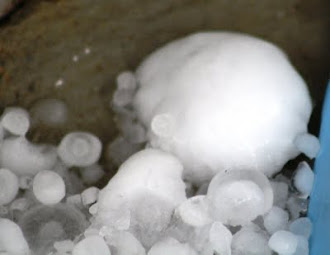 Photograph of hail ball by back door. Notice smaller pieces on sides. July 14, 2011.