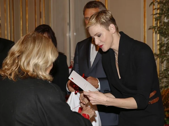 Prince Albert II of Monaco and Princess Charlene of Monaco attends parcels distribution at the Monaco Red Cross headquarters 