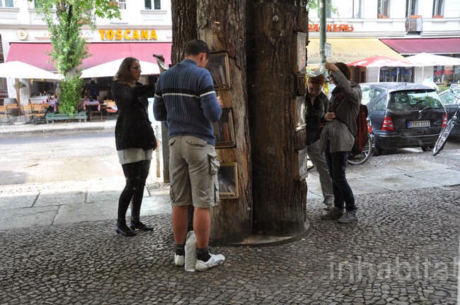 This kiosk is made from fallen trees and built to look like a group of trees in the forest. - A Neighborhood In Germany Has An Awesome Book Exchange Inside Of Trees This kiosk is made from fallen trees and built to look like a group of trees in the forest. - A Neighborhood In Germany Has An Awesome Book Exchange Inside Of Trees