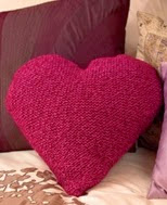http://www.letsknit.co.uk/free-knitting-patterns/heart_cushion