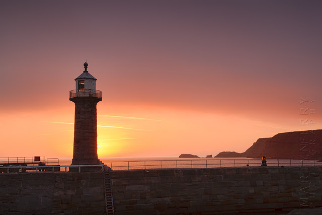 Sunrise photograph of Whitby lighthouse in North Yorkshire by Martyn Ferry Photography