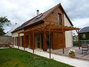 Suite du chantier de maison bois en madrier dans l'Eure et Loir près de . maison contemporaine en bois