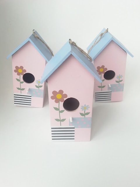 painting birdhouses to brighten up the garden