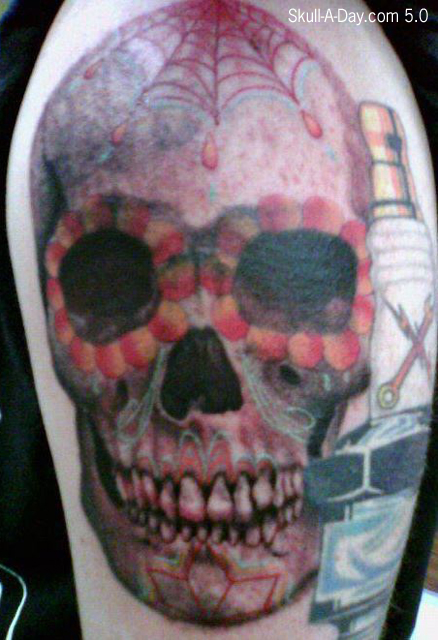 The black and grey sugar skull was done by Eric Solomon