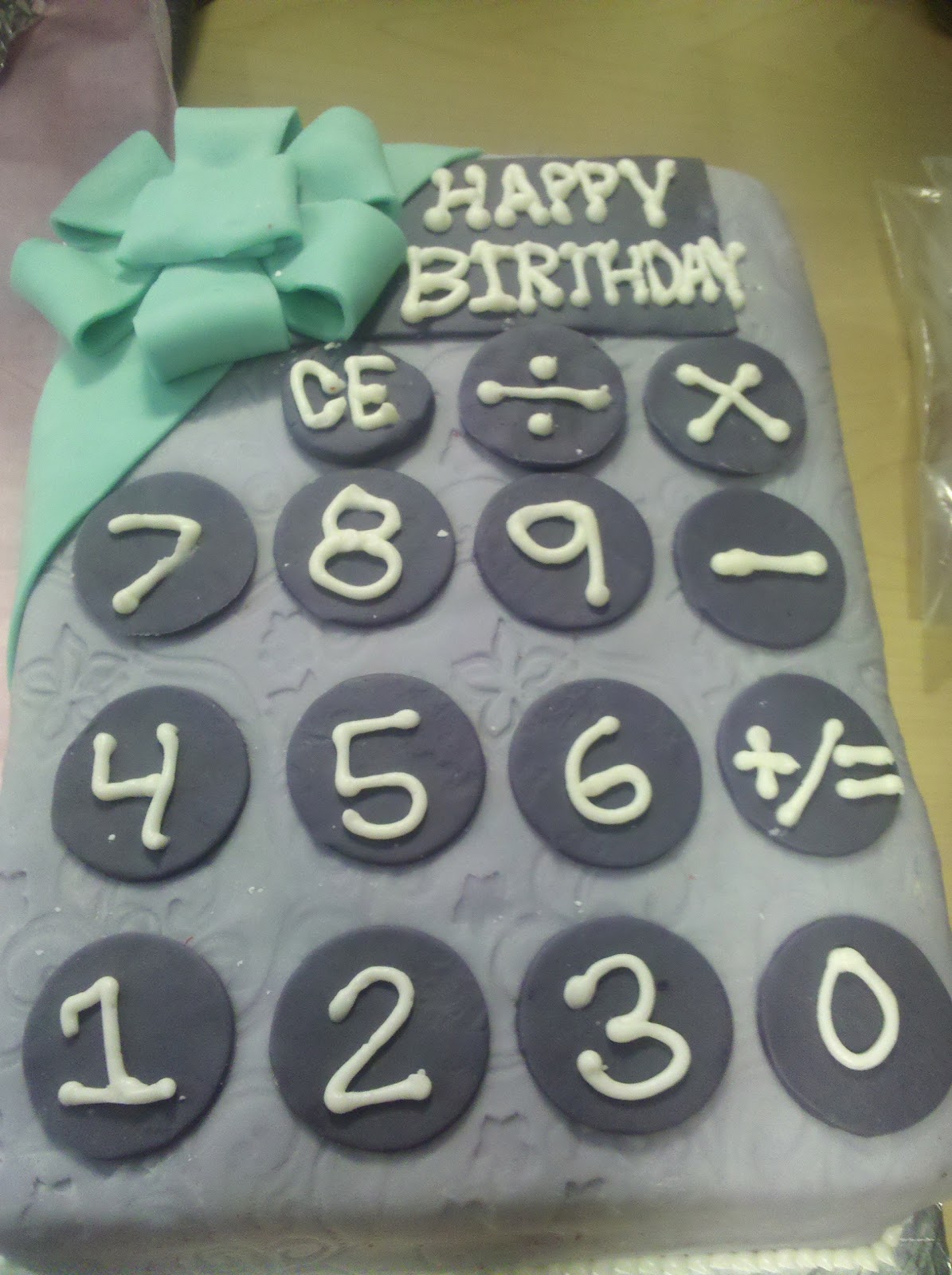 Casio calculator cake. The cake is rectangular and everything is ...