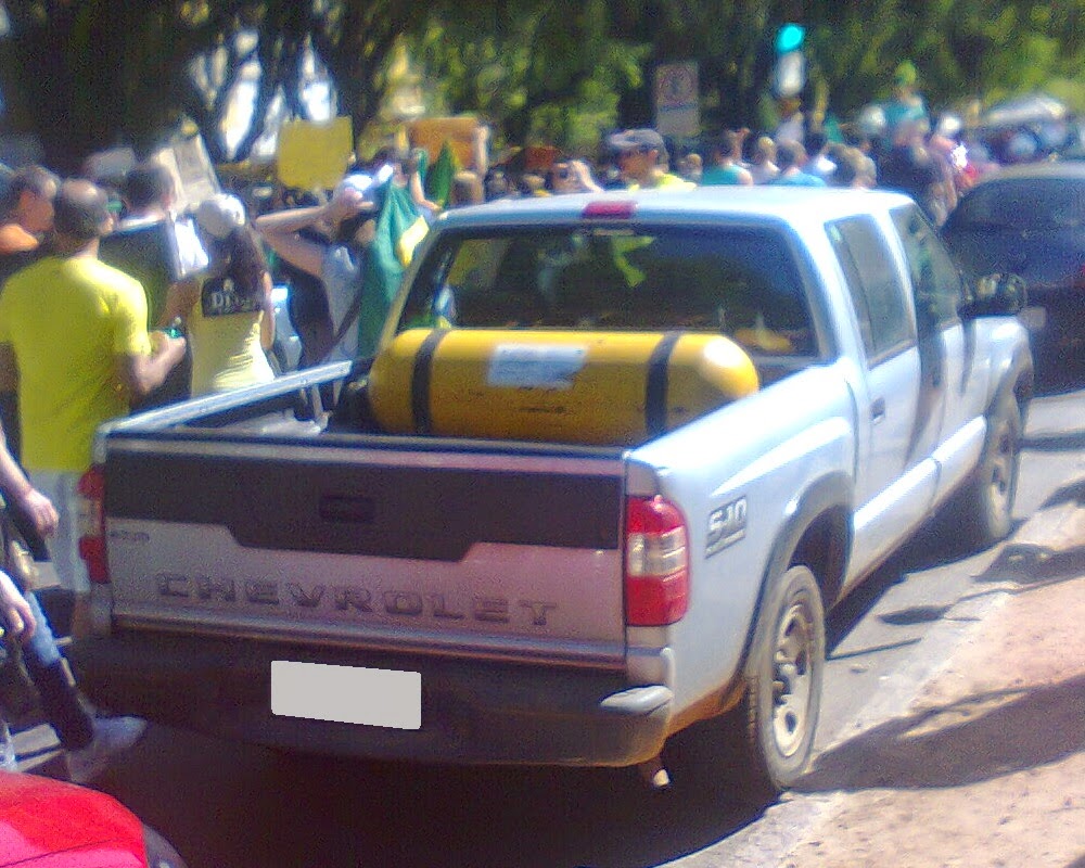 A few trucks converted to bifuel gasoline/CNG in my hometown Fuel