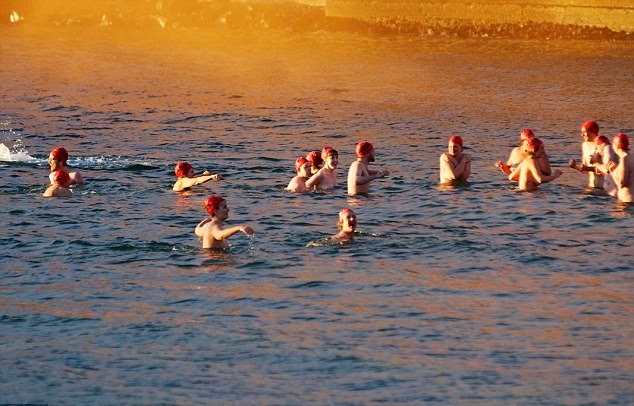 Nude swim: Hundreds brave the cold to skinny dip in Hobart 