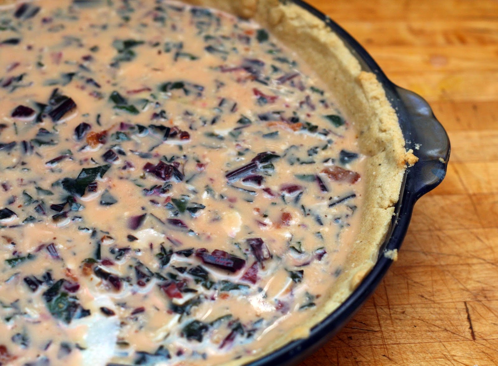 Goose Egg Quiche with Beet Greens and Bacon and a ParmesanPepper Crust
